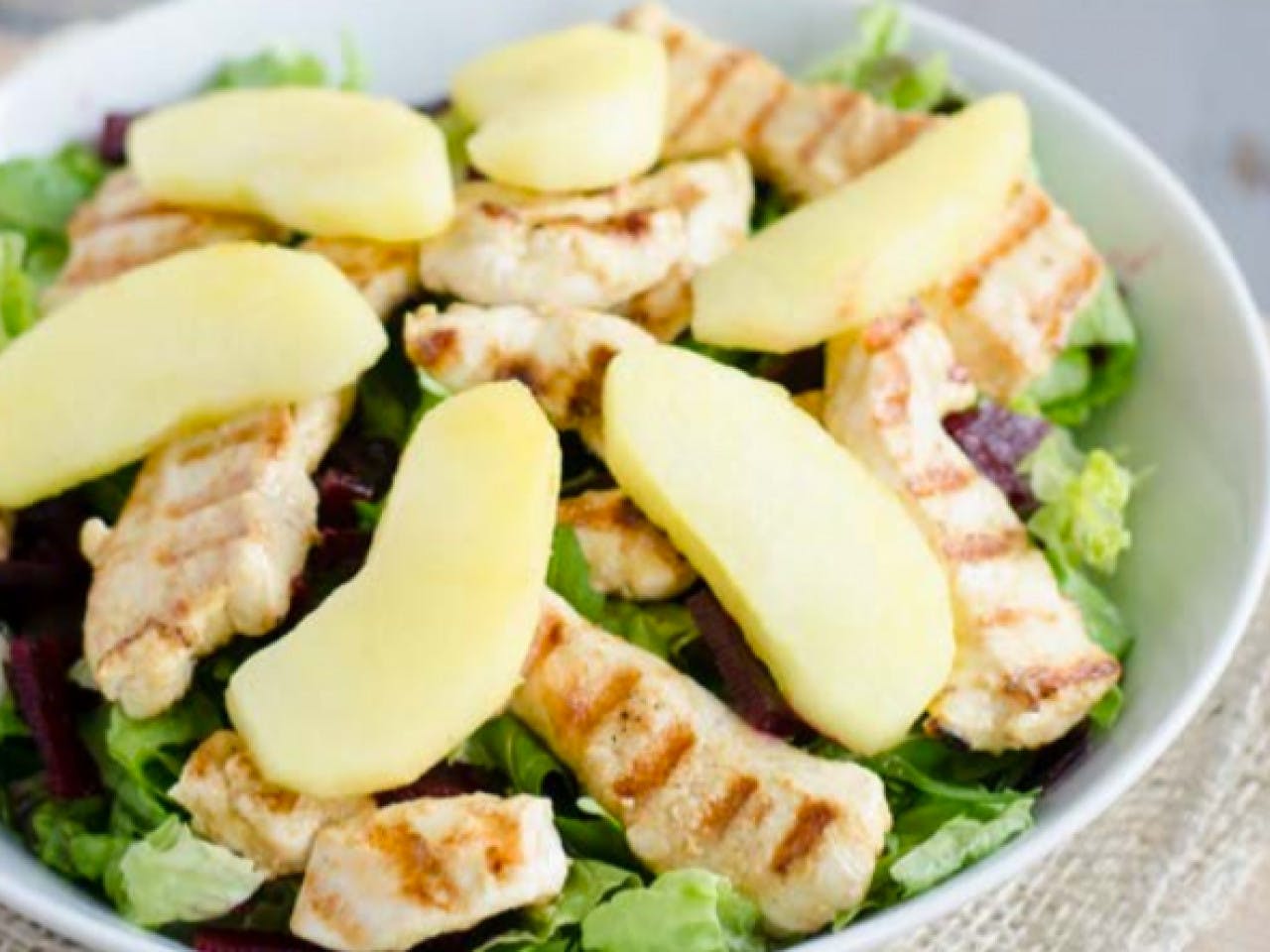 Winter salad with chicken, apple and red beets