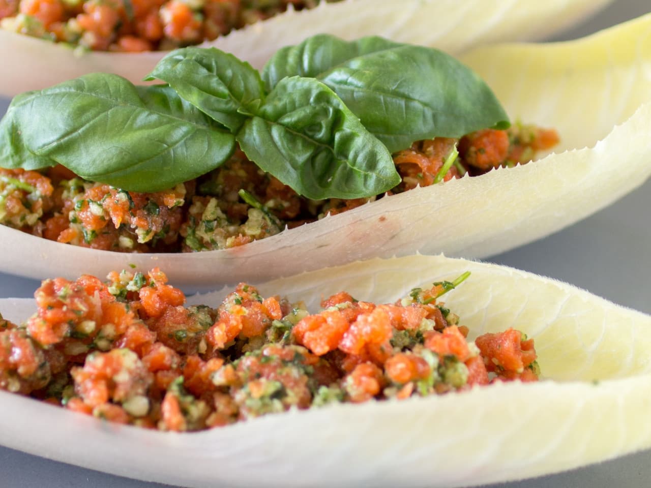 Pesto salmon in chicory boats