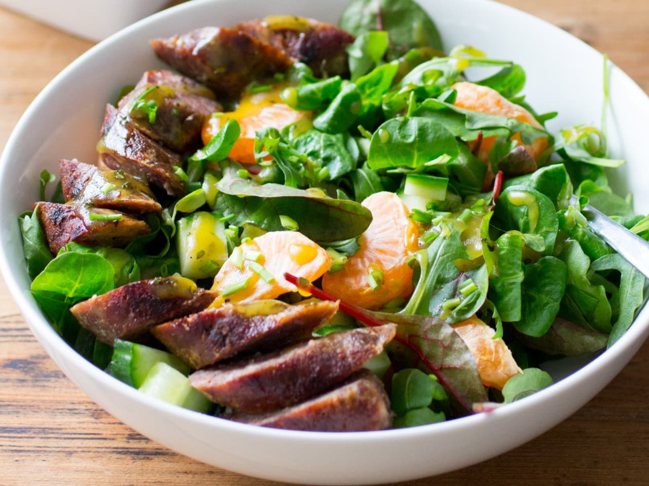Fresh summer salad with BBQ sausage