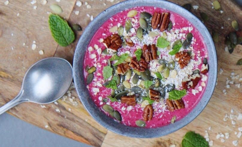 Pink smoothie bowl with strawberry and beet