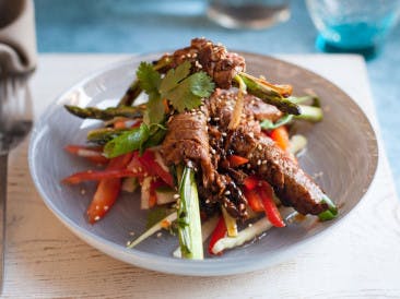 Asparagus roast beef rolls with pepper salad