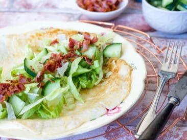 Omelet roll with salad and bacon