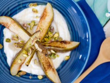Coconut yogurt with grilled pear and pistachio