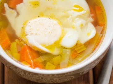 Clear chicken soup with an egg