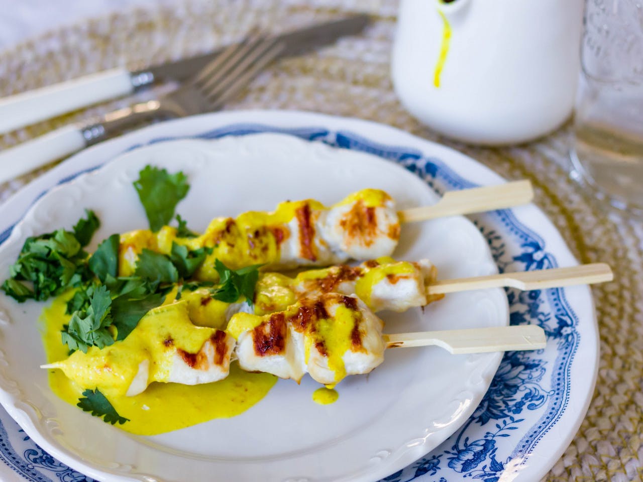 Chicken skewers with curry sauce