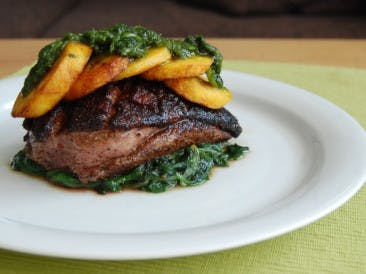 Spicy duck breast with plantain and coriander-mint sauce