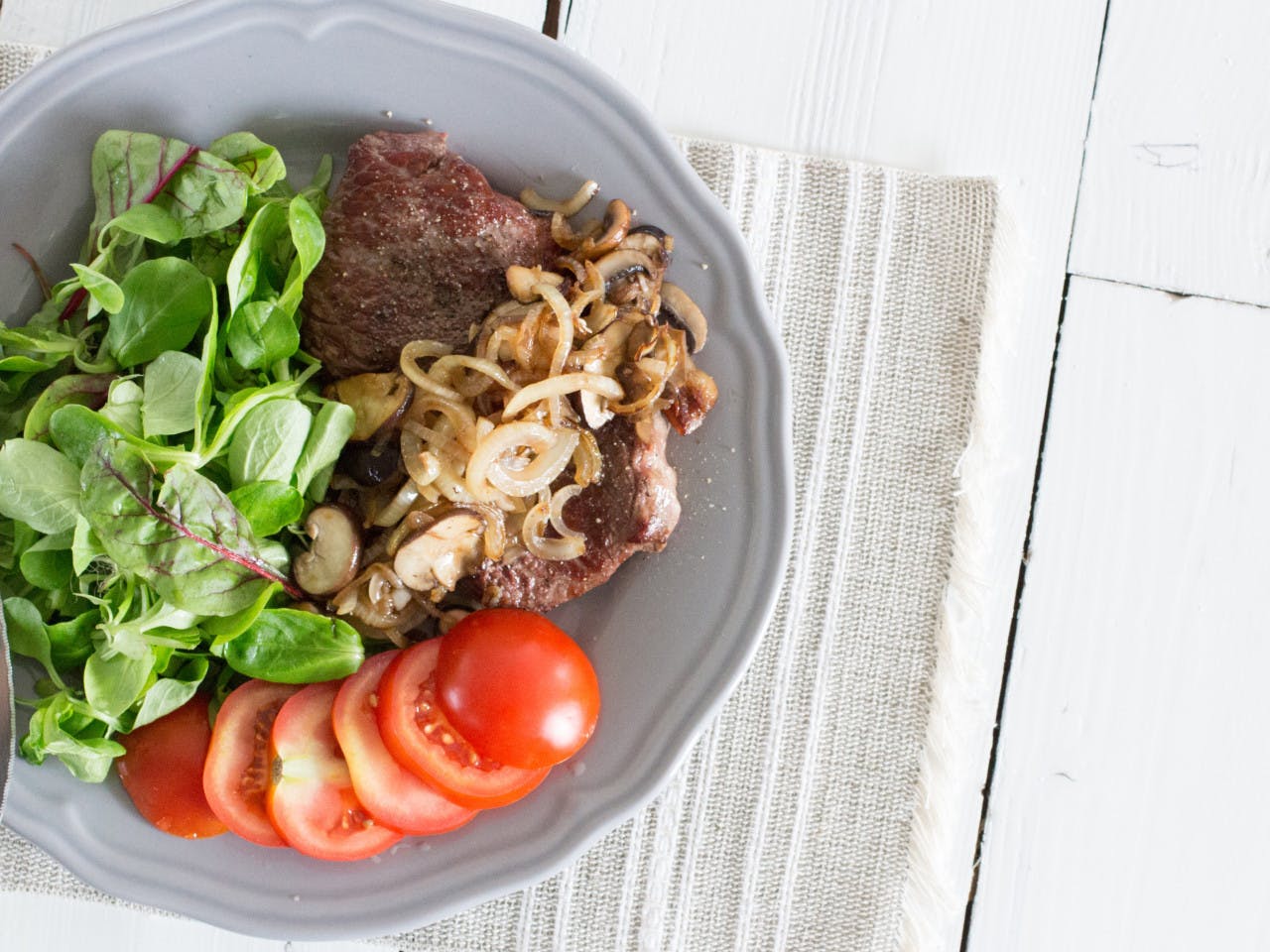 Porterhouse steak with onion and mushrooms