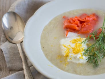 Asparagus soup with lemon cream and salmon
