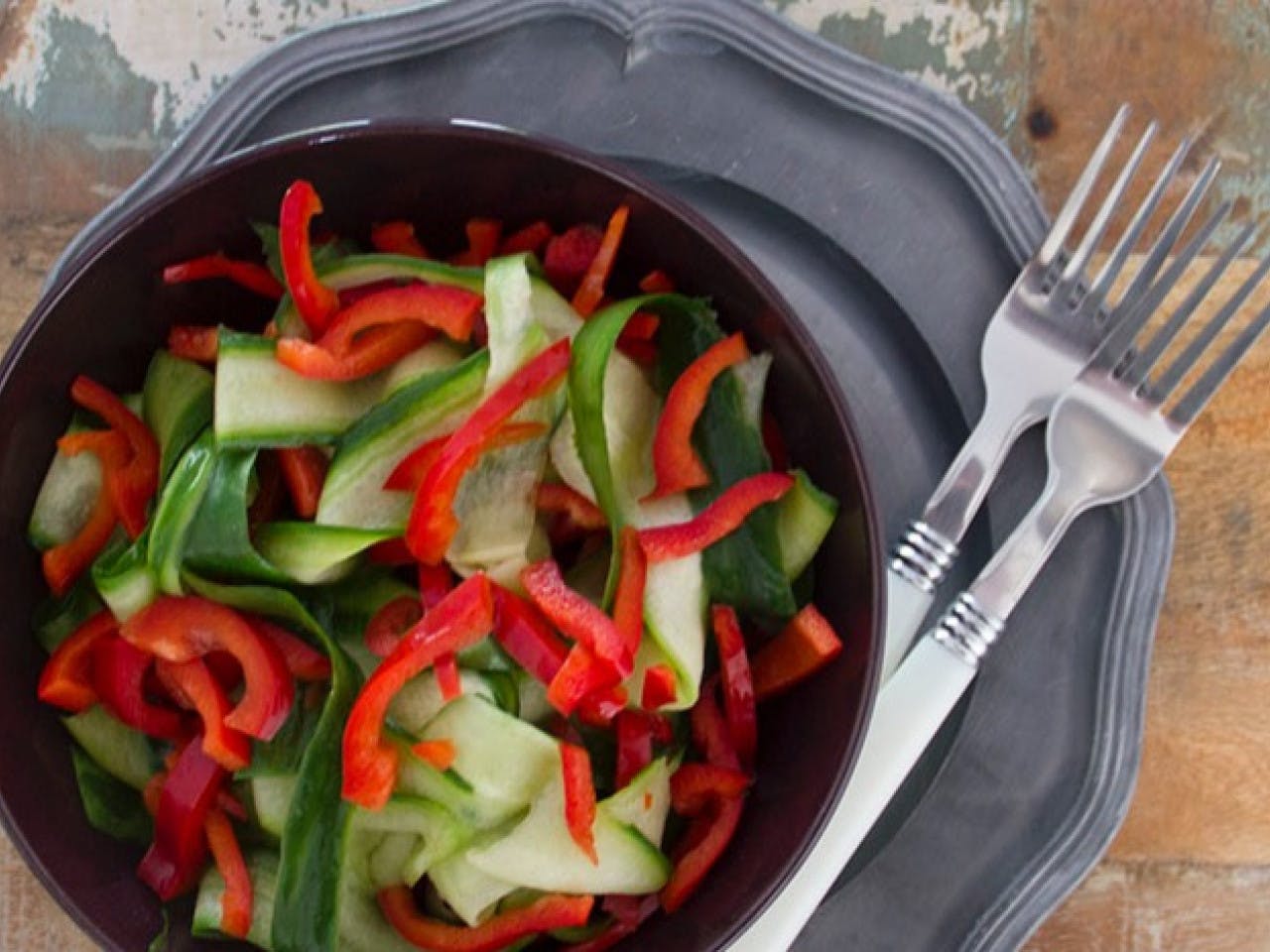 Fresh cucumber ribbons with bell pepper