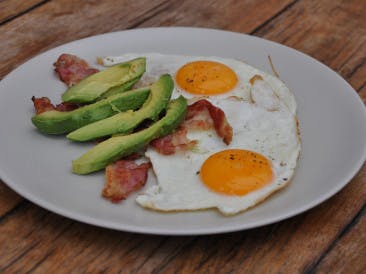 Fried eggs with bacon and avocado