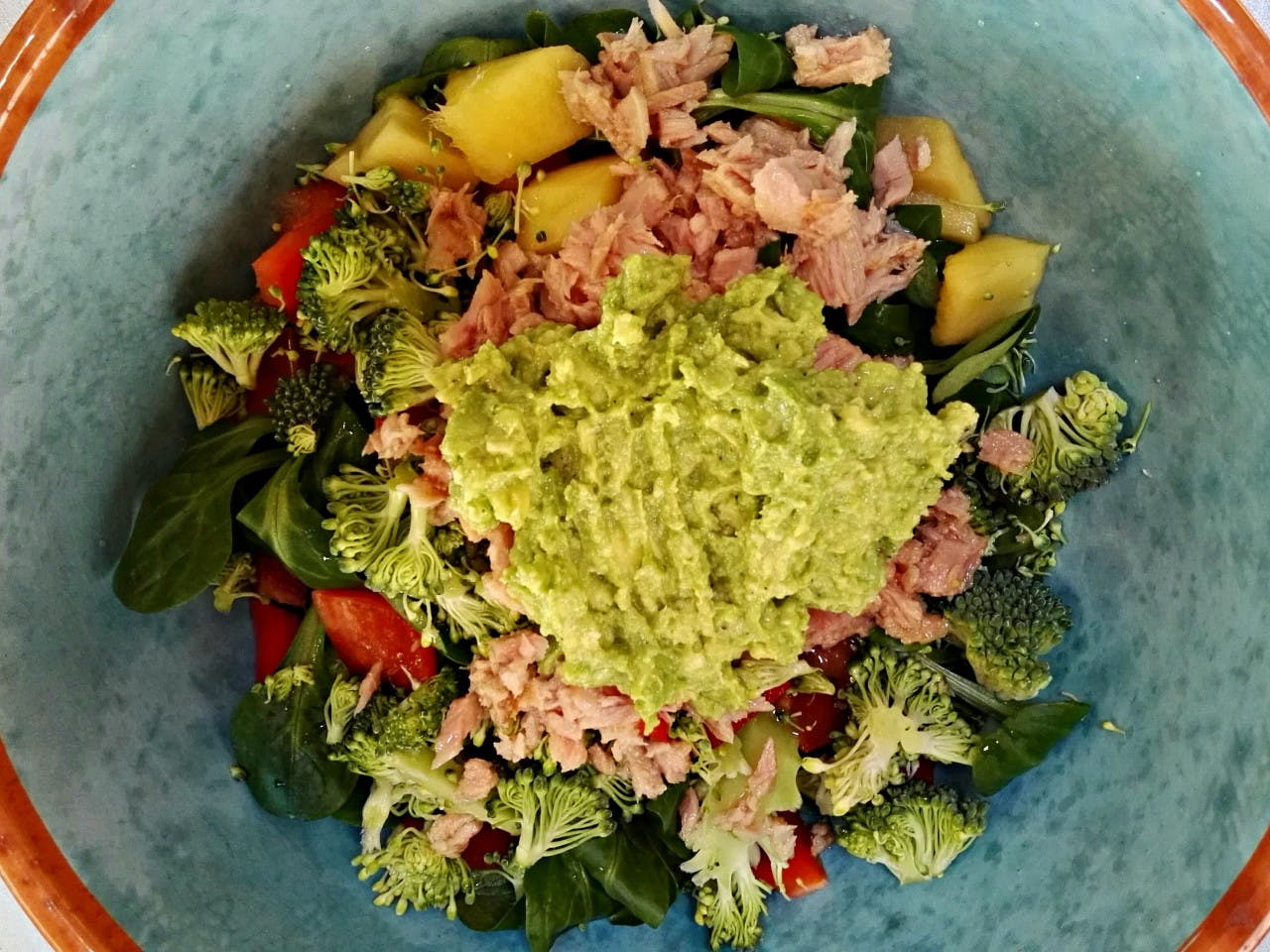 Creamy tuna salad with broccoli and grated lemon