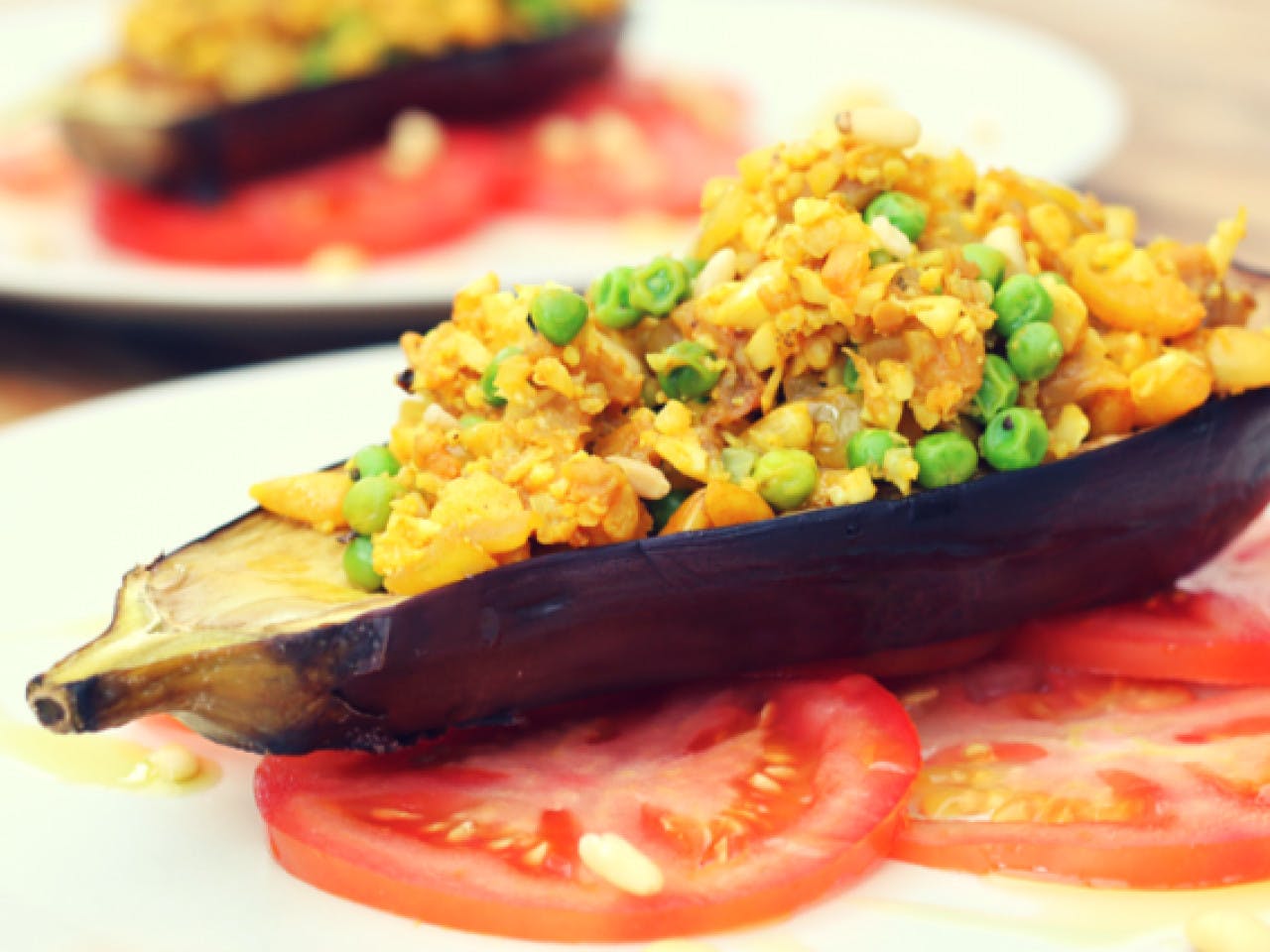 Stuffed aubergine with couscous and peas