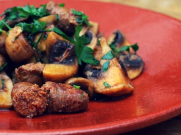 Spiced sausages with mushroom and cucumber salad