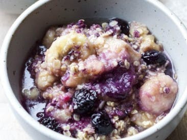 Breakfast of banana, berries and oatmeal from the oven