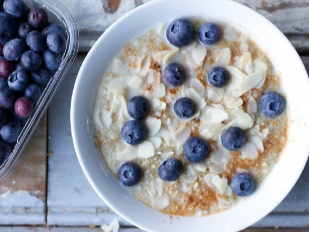 Vegan quinoa breakfast with almonds and blueberries