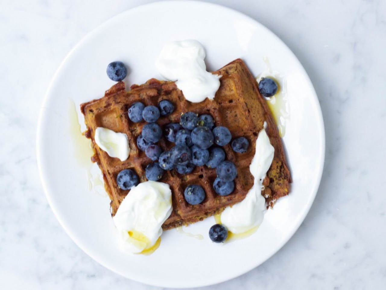 Waffles with blueberries and coconut yogurt