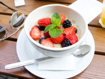 Vegan oatmeal with strawberries and blackberries