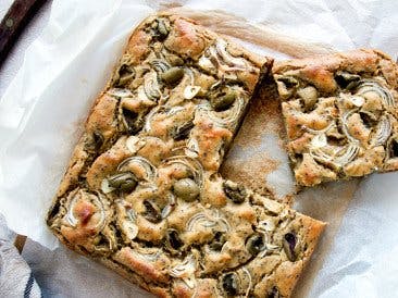Savory chickpea cake with olives and caraway seeds